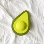 Avocado clitoral vibrator button-controlled body-safe toy in green, front view on white background