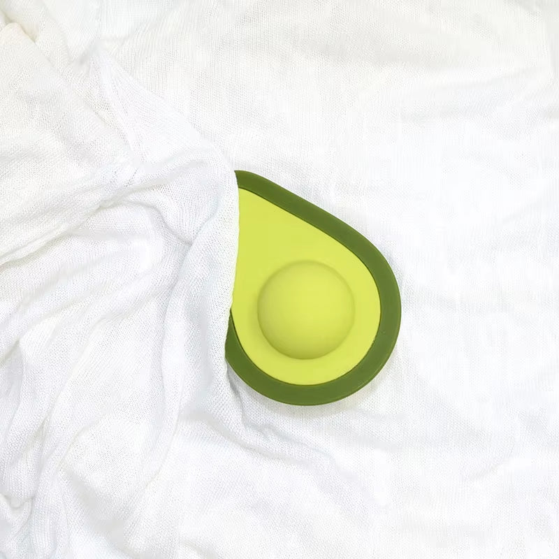 Avocado clitoral vibrator button-controlled body-safe toy open view showing inner stimulator